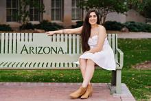 kristina raygoza sitting on an arizona bench