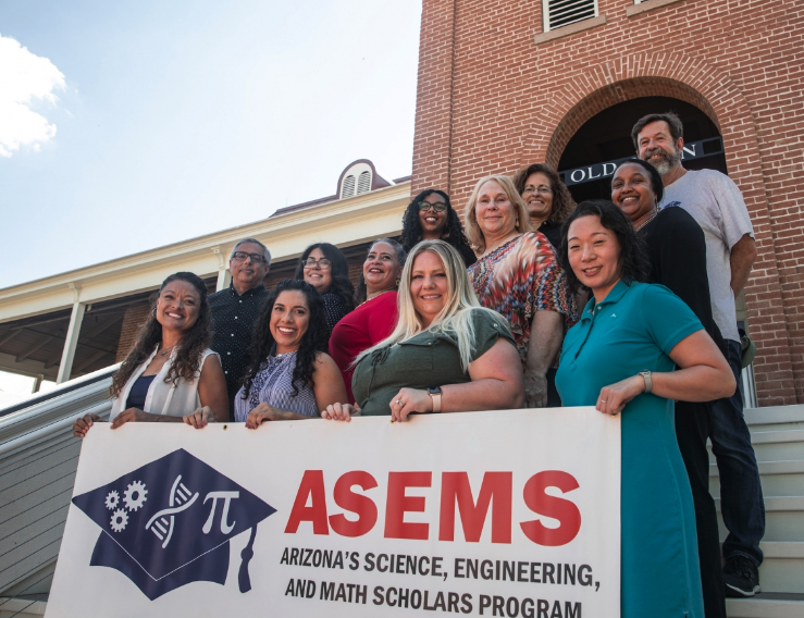 ASEMSgroup photo on the steps of old main under a sunny sky